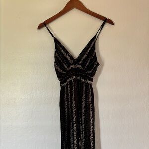 unique black romper with floral pattern | size: M